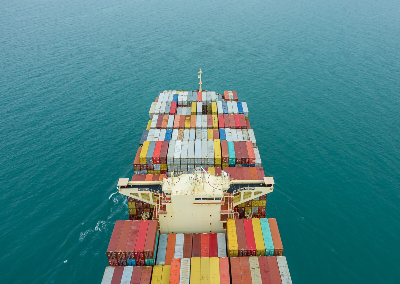 aerial-top-view-of-cargo-ship-carrying-container-for-import-export-goods-to-customer